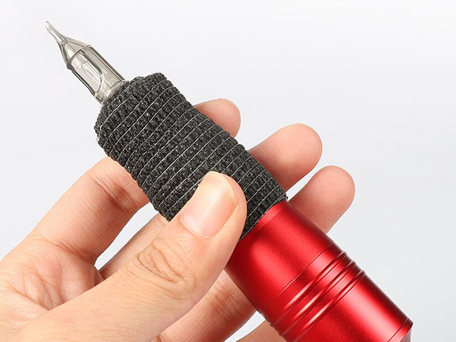 Tattoo aftercare with cohesive bandage protecting fresh sleeve tattoo healing process