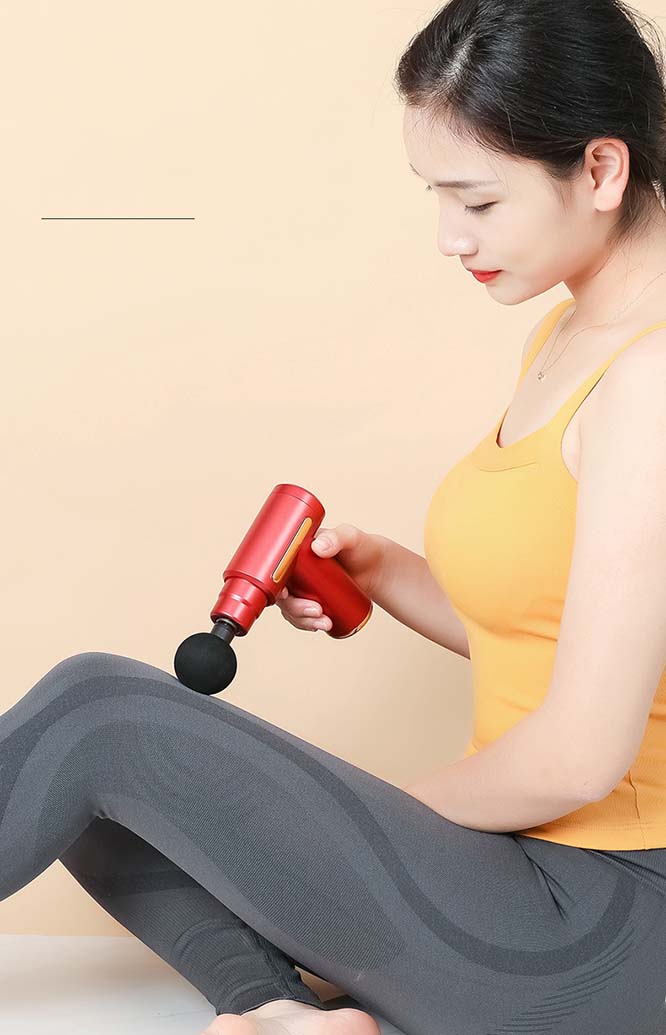 Muscle massage gun used for leg recovery and deep tissue relaxation after exercise