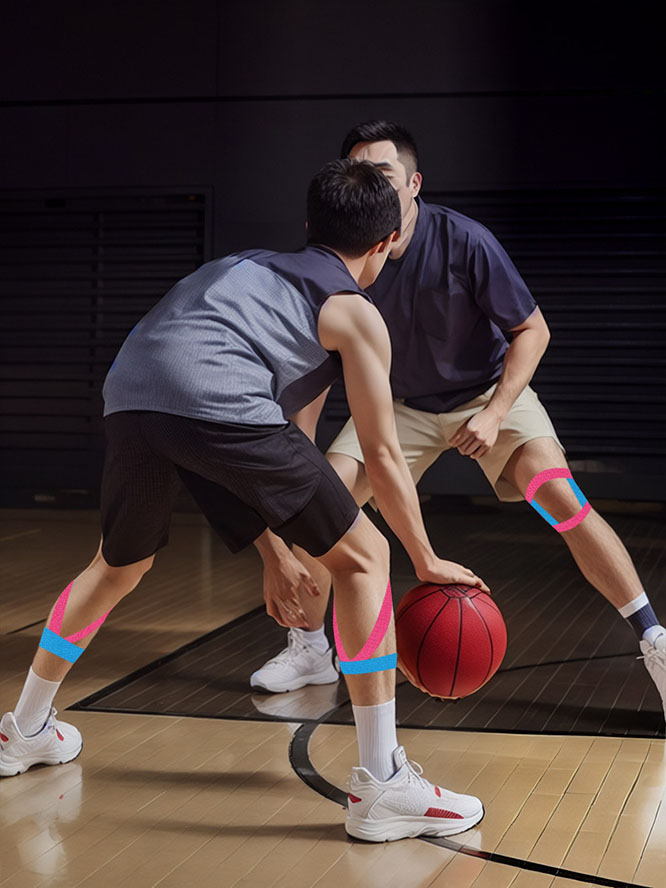 Two basketball players are competing on an indoor court, with kinesiology tape applied to their knees and thighs for support during defensive movement